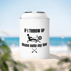 May include: White can cooler with black text and a rowing machine graphic. The text reads "If I throw up please note my time".