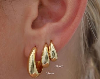 May include: Three gold hoop earrings of different sizes. The smallest hoop is 12mm, the middle hoop is 14mm, and the largest hoop is 17mm.