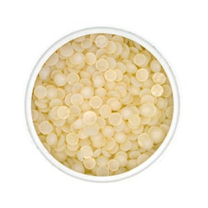 May include: A white bowl filled with small, round, off-white beads.