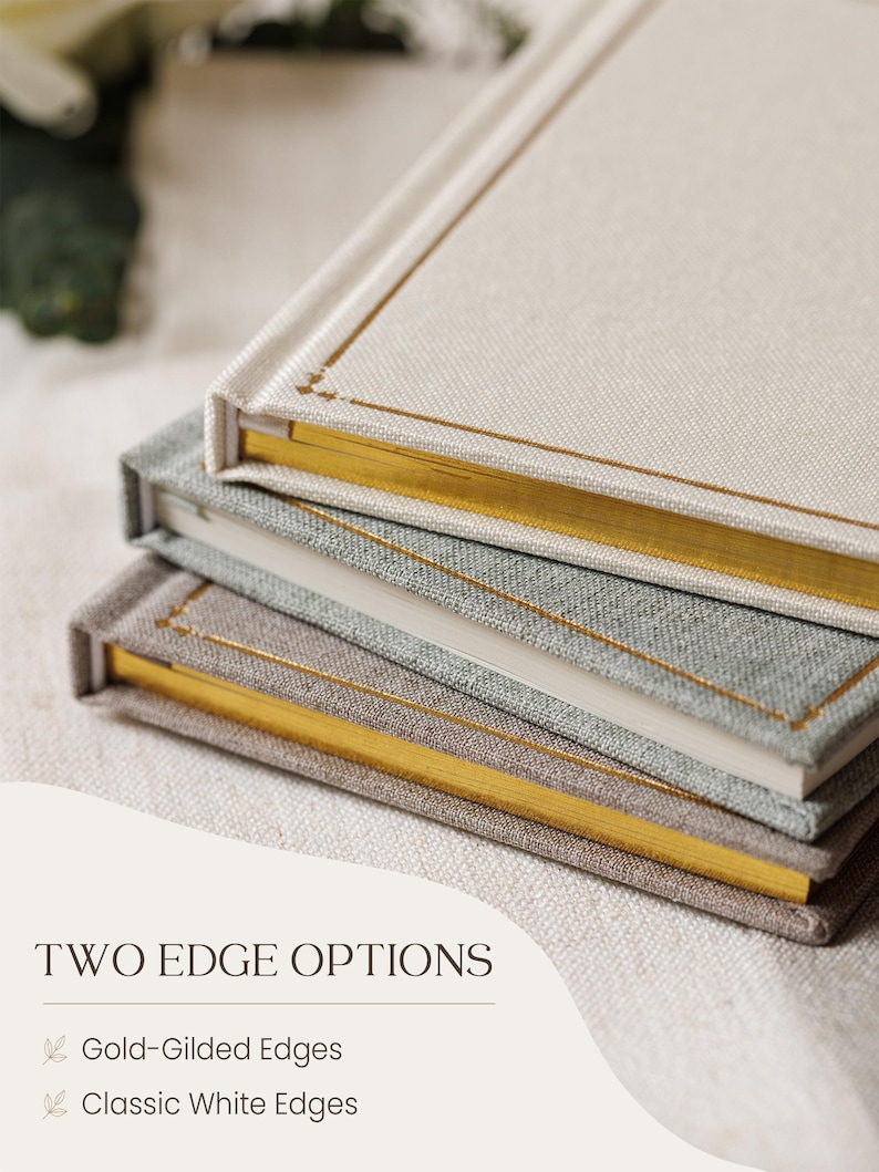 May include: Three stacked books with fabric covers in cream, light grey, and tan. The top two books feature gold-gilded page edges and a thin gold border on the cover. The bottom book has classic white page edges. Text reads: TWO EDGE OPTIONS.