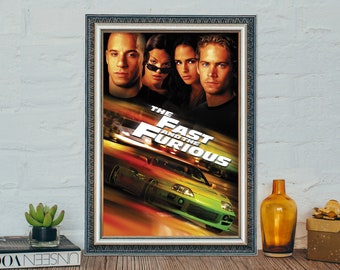 May include: A movie poster for "The Fast and the Furious" featuring Vin Diesel, Michelle Rodriguez, Jordana Brewster, and Paul Walker. The poster has a green car speeding down a road with a yellow and orange blur in the background.