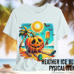 May include: Pale blue t-shirt with a Halloween-themed illustration. The design shows a melting jack-o'-lantern skeleton on a beach, holding a popsicle, with a palm tree and bats. Text at the bottom reads "HEATHER ICE BLUE FYSICAL ITEM".