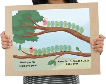 May include: A framed artwork showing a tree branch with caterpillar illustrations made of fingerprints. The artwork includes the text "thank you for helping us grow!" and "Love, Mr. E's Grade 1 Class 2024-2025". The background is light blue.
