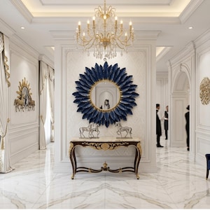 May include: An elegant entryway with a marble floor, ornate white walls, and a gold chandelier. A large blue feather mirror hangs above a marble-topped console table with horse sculptures. A blue velvet bench sits to the right.