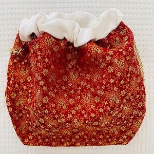 Handgefertigte Fallera-Stofftasche. Handgefertigte Tasche aus valencianischem Stoff. Valencianische Kunst.
