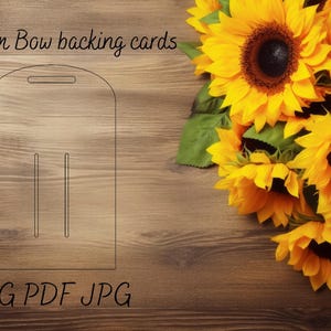 May include: A line drawing of a medium bow backing card template on a wood background. The template has three slots for inserting ribbon. The text "Medium Bow backing cards" and "SVG PDF JPG" are visible on the image. A bouquet of sunflowers is in the upper right corner of the image.