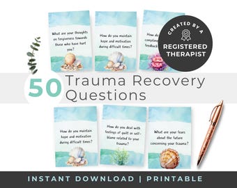 May include: A set of 50 trauma recovery question cards featuring watercolor illustrations of seashells and coral. Each card displays a prompt in black text against a blue and white background. A rose gold pen is positioned to the right.