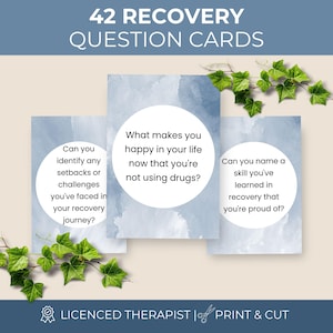 Pode incluir: Um conjunto de 42 cartões de perguntas de recuperação com um fundo de aguarela azul e áreas de texto circulares brancas. Os cartões exibem perguntas como What makes you happy in your life now that you're not using drugs? e Can you name a skill?