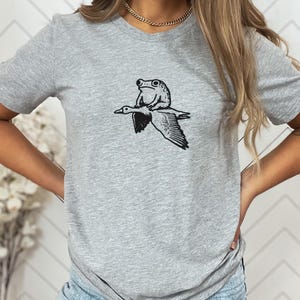 Seltsames Frosch- und Gans-Shirt - schrulliges Tier-wunderliches Geschenk-T-Stück - Kröten-Reitgans-T - Lustiges Tier-T-Shirt - Meme-T-Stück Heather Grey