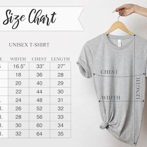 May include: A light gray unisex t-shirt hanging on a wooden hanger. The image includes a size chart with measurements in inches for width, chest, and length, ranging from XS to 5XL. The text "Size Chart" is at the top.