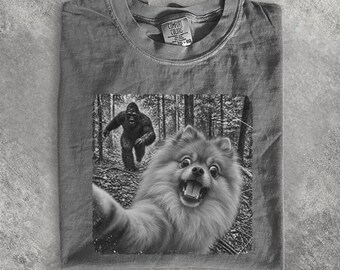 Pomeranian T-Shirt Funny Big Foot Running After Dog Shirt