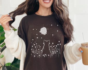 Moon Raccoon T-Shirt: Starry Night Meadow with Flowers – Celestial Nature Tee for Animal & Sky Lovers, Minimal Linocut Style