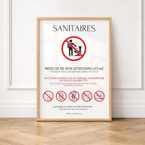Peut inclure: Une affiche encadrée avec le texte SANITAIRES et un symbole d'interdiction rouge sur des toilettes. Elle liste en français et en anglais les objets à ne pas jeter, comme le coton, les serviettes, tampons, nourriture, couches et lingettes.