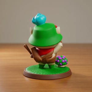 May include: A figurine of a character wearing a green hat, red scarf, and brown outfit, holding a wooden object. The figure stands on a green base with a mushroom and a brown border. A blue object sits atop the hat.