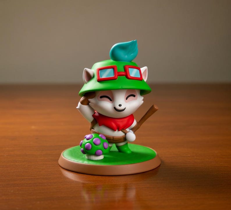 May include: A figurine of a character with white fur, a green hat, and red-framed glasses. The character is holding a wooden staff and standing on a green base with a mushroom. The figurine has a red scarf and a brown belt.