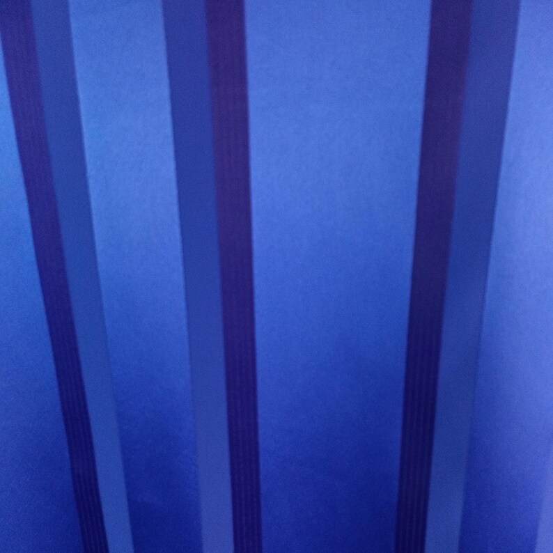 May include: Abstract image featuring a gradient of blue hues with vertical stripes. The stripes vary in shades, creating a dynamic visual effect. The design is simple yet visually engaging, suitable for various applications.