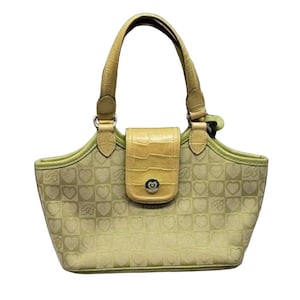 May include: A light green and yellow handbag with a heart pattern and a flap closure. The handbag has two top handles.