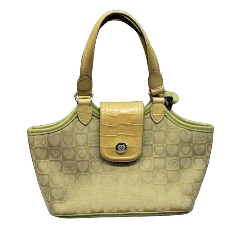May include: A light green and yellow handbag with a heart pattern and a flap closure. The handbag has two top handles.