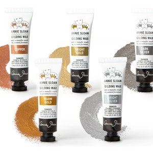 May include: Six tubes of Annie Sloan Gilding Wax in various metallic colors: Copper, Bright Gold, Dark Silver, Warm Gold, Bright Silver. Each tube is 15 ml (0.5 US fl oz).