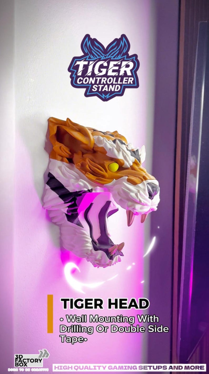 May include: A wall-mounted tiger head controller stand. The tiger head is orange, white, and black with yellow eyes and sharp teeth. The text "TIGER CONTROLLER STAND" is above the tiger head. The text "TIGER HEAD" is below the tiger head.