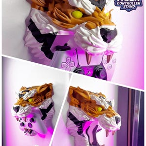 May include: A tiger-head controller stand in shades of brown, white, and black, with yellow eyes and pink lighting. The stand holds a white game controller. Text on the image reads "TIGER CONTROLLER STAND" and "HIGH QUALITY GAMING SETUPS AND MORE."