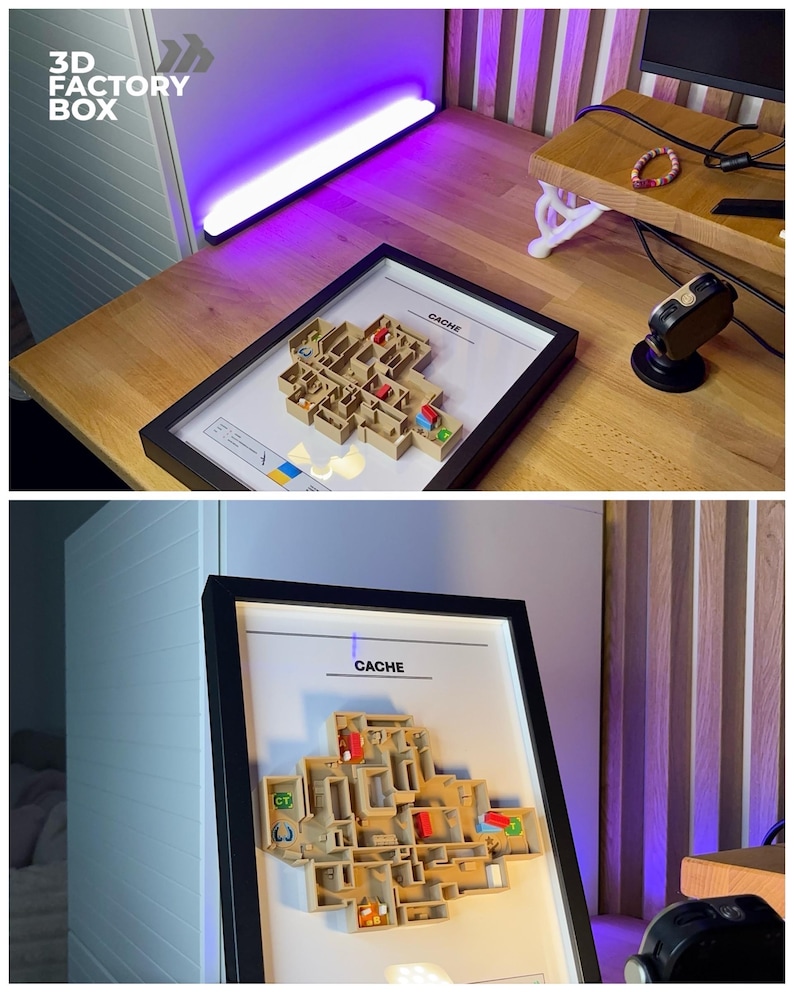 May include: A framed 3D model of a map labeled "CACHE" with a black frame. The model is beige with red and green accents, and is displayed on a wooden desk. The text "3D FACTORY BOX" is in the upper left corner.