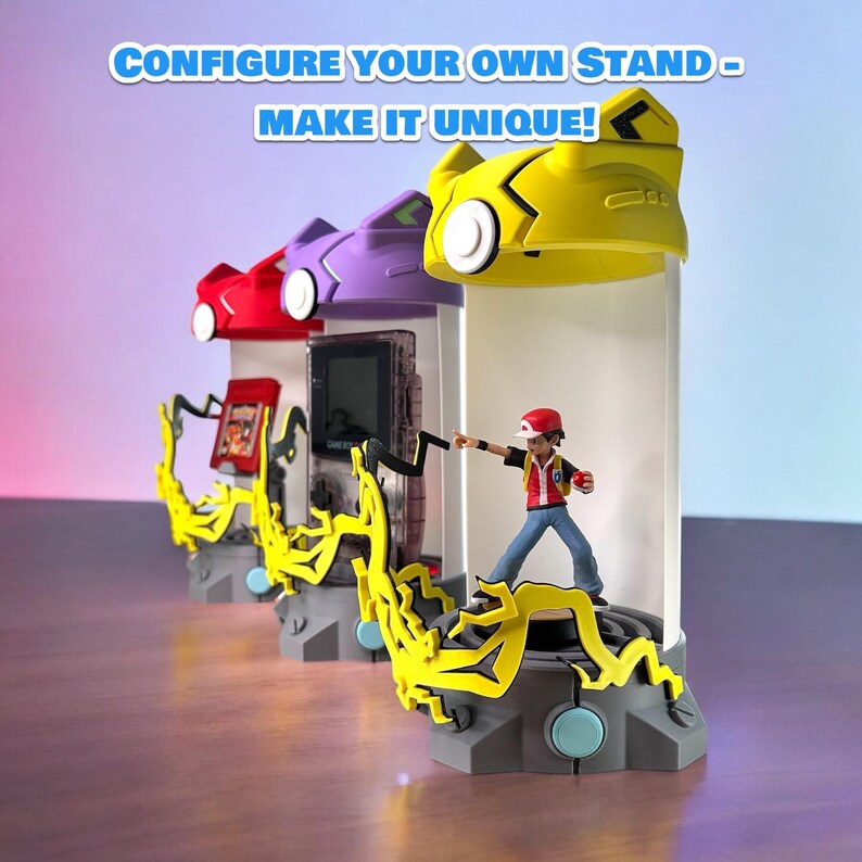 May include: Three different colored stands with a yellow, purple, and red top. Each stand has a different Pokemon character on it. The yellow stand has a figure of a trainer with a red hat and a red shirt. The stand has a yellow lightning bolt design. The text "CONFIGURE YOUR OWN STAND - MAKE IT UNIQUE!" is at the top of the image.