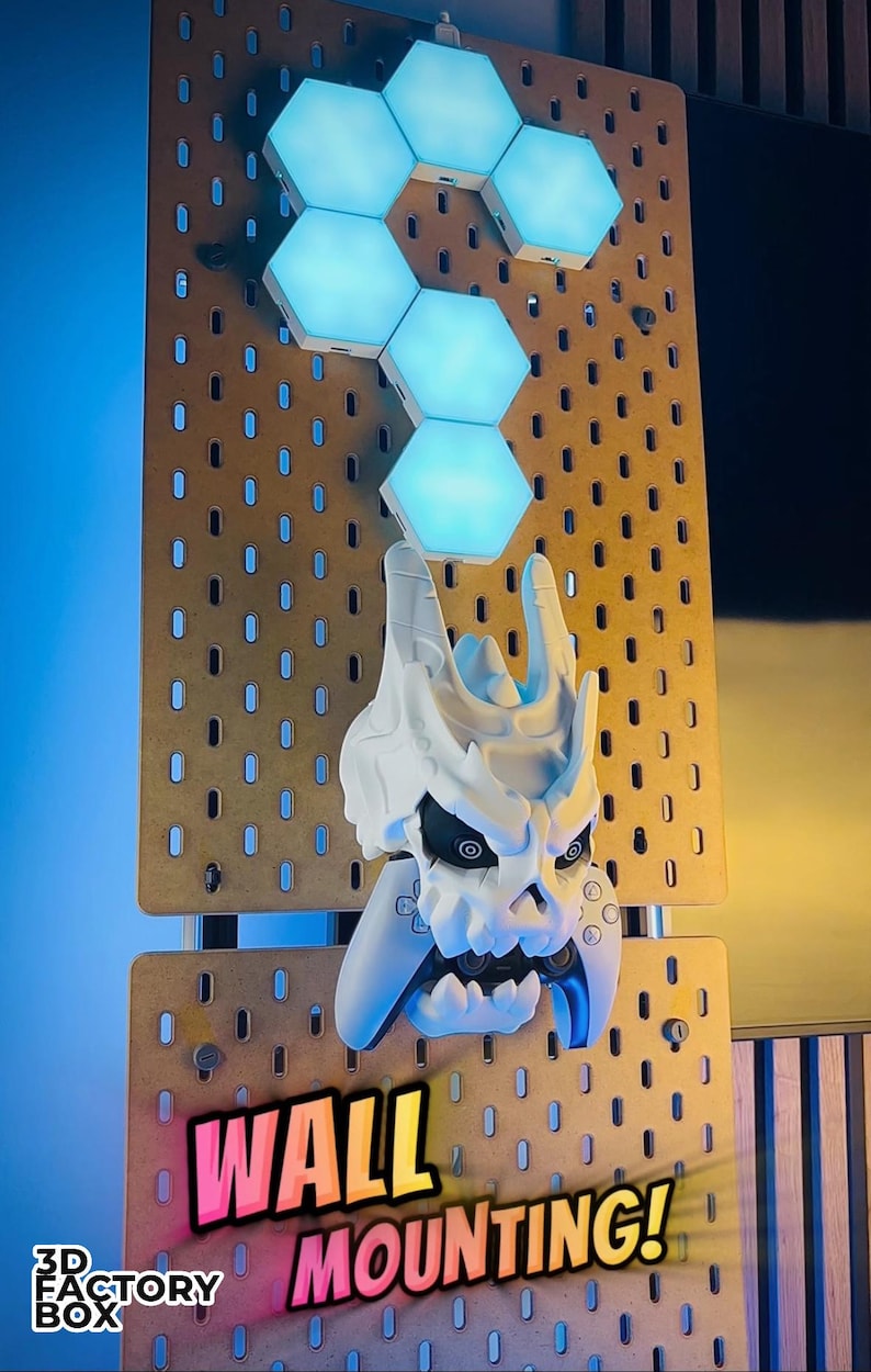 May include: A white skull-shaped wall mount with a video game controller, mounted on a pegboard. Above the skull are six blue hexagonal LED lights. The words "WALL MOUNTING!" are displayed in a colorful font.