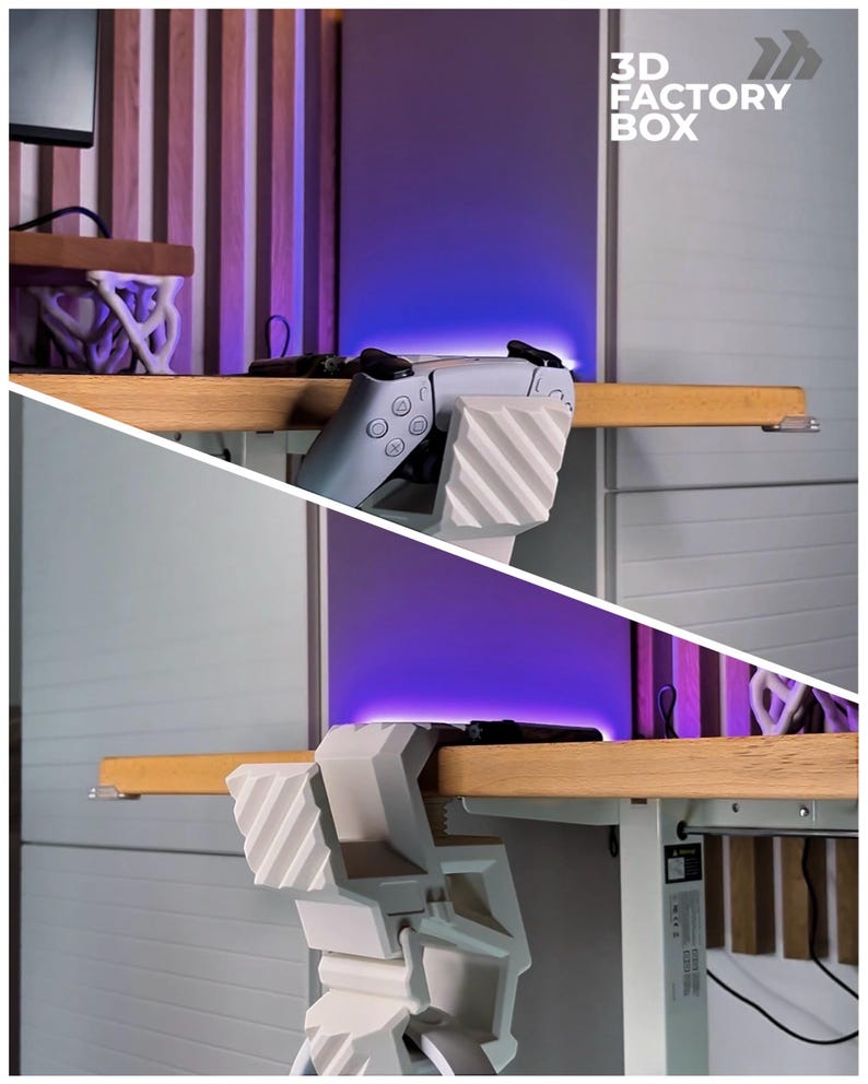 May include: A white and gray gaming controller is held by a white 3D-printed holder attached to a wooden desk. The image includes the text "3D FACTORY BOX". The background features a purple glow and wooden paneling.