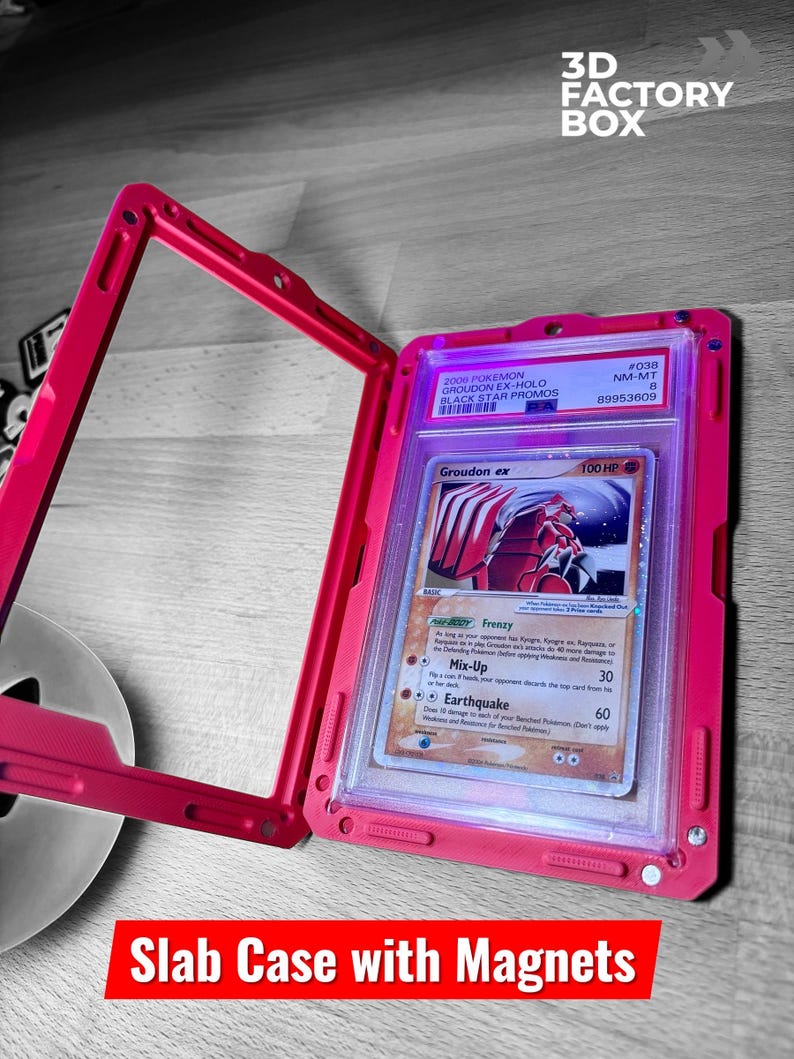May include: A pink slab case with magnets, holding a Pok&eacute;mon card. The card features a red and white Groudon ex illustration. The case has the text "3D FACTORY BOX" and "Slab Case with Magnets".