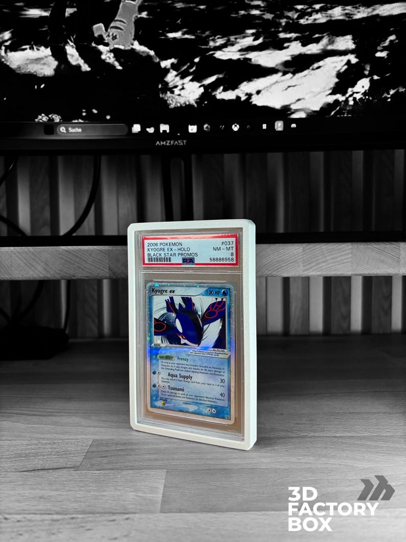 May include: A graded Pok&eacute;mon card featuring Kyogre ex from the 2006 Black Star Promos set. The card is encased in a clear protective holder with a white frame. The card's artwork showcases a blue and white Kyogre with the text "Kyogre ex".