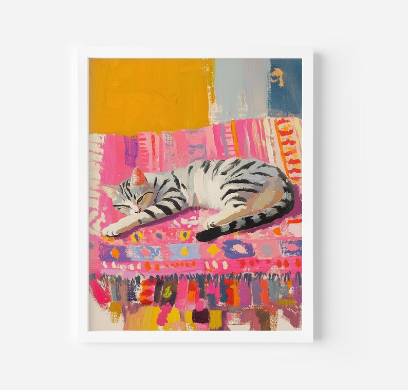 May include: A gray and white tabby cat sleeps on a colorful pink, orange, and yellow patterned rug. The rug has a fringe border.