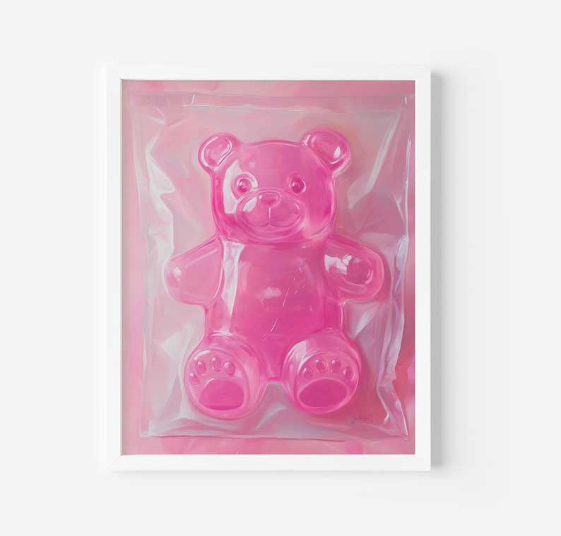 May include: A pink gummy bear shaped like a teddy bear is packaged in clear plastic wrap. The bear is sitting on a pink background.