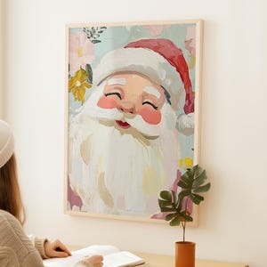 May include: A painting of Santa Claus with a white beard and a red hat. He is smiling and has his eyes closed. The background is a light blue with pink and yellow flowers.