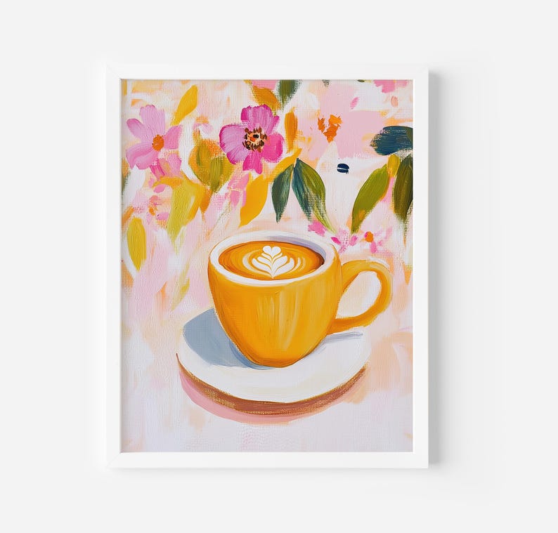 May include: A framed painting of a yellow coffee cup with latte art, resting on a white saucer. The background features a colorful floral design with pink and yellow flowers and green leaves. The artwork is set against a white background.