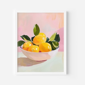 May include: A framed art print featuring a still life of lemons in a bowl. The lemons are yellow with green leaves, arranged in a light pink bowl. The background is a soft pink and white.