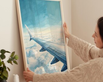 Puede incluir: Una impresión enmarcada de una vista desde la ventana de un avión, que muestra el ala del avión y nubes blancas y esponjosas contra un cielo azul.