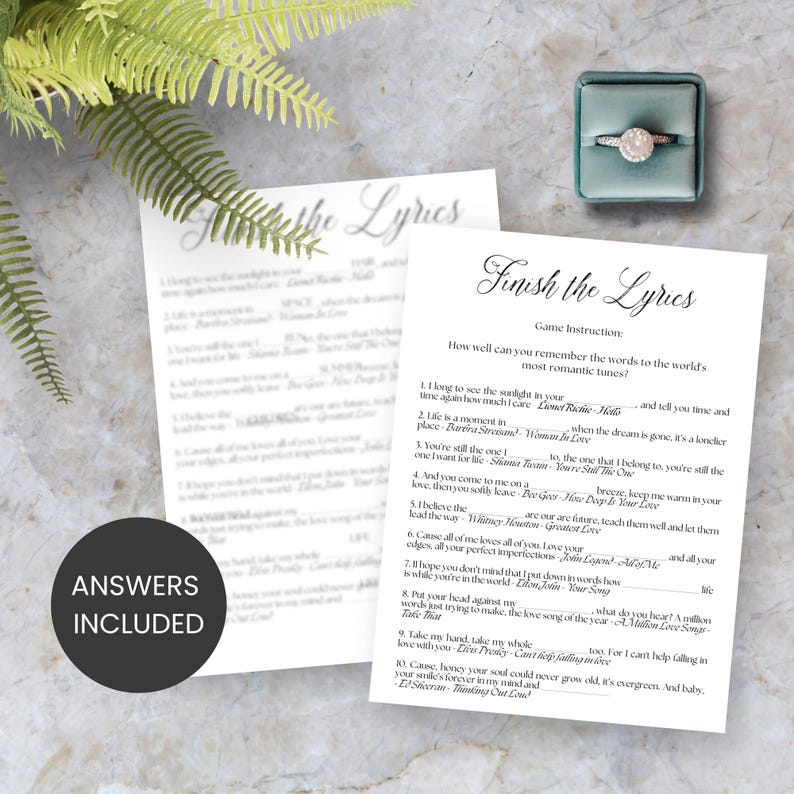 May include: A printable game card with the title "Finish the Lyrics" and instructions for a game where players try to complete the lyrics to popular love songs. The card is white with black text and a decorative font.