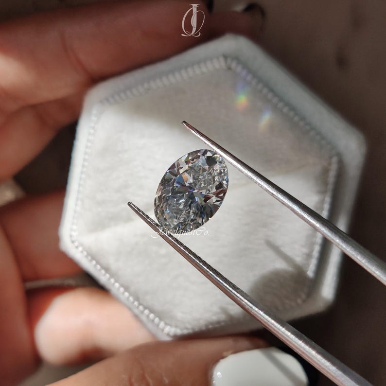 Macro photograph of a loose oval lab-created diamond glowing under natural sunlight, highlighting its impeccable clarity and ideal cut proportions. The fine craftsmanship enhances brilliance, fire, and scintillation, rivaling any mined diamond. Ethically grown and conflict-free, this sustainable gemstone represents responsible luxury. Perfect for engagement rings or anniversary gifts, the oval cut offers timeless beauty and a flattering elongated shape that complements every jewelry design