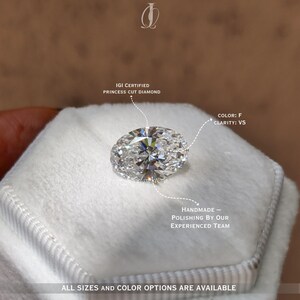 Beautiful close-up of an oval cut lab-grown diamond resting on a white silk background, capturing its flawless symmetry and high brilliance. Each facet reflects light like a prism, radiating elegant flashes of rainbow fire. Ethically created through sustainable lab processes, this conflict-free oval diamond offers an eco-conscious alternative to mined stones. Its classic elongated shape enhances sparkle and finger length, perfect for bespoke engagement rings and modern minimalist jewelry