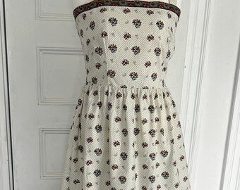 Vintage fitted sundress made from French oulivado fabric in white with dots and border trim. Sewn and designed by Red Mill Collection.