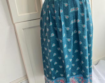 Vintage skirt made from French oulivado fabric in Emerald border print  and soft pleads. Sewn in the US by The Red Mill Collection. Size 14