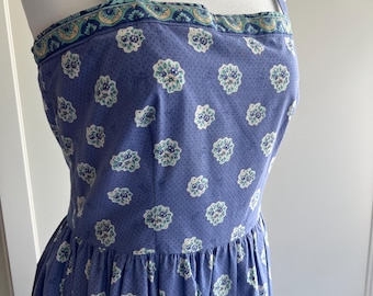 Vintage fitted sundress made from French oulivado fabric in French blue with dots and border trim.Sewn by the Red Mill Collection.