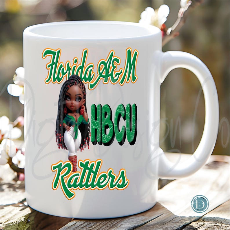 May include: White ceramic mug featuring the text "Florida A&M HBCU Rattlers" in green and orange script. A cartoon illustration of a Black woman in a green top and white pants is also on the mug.