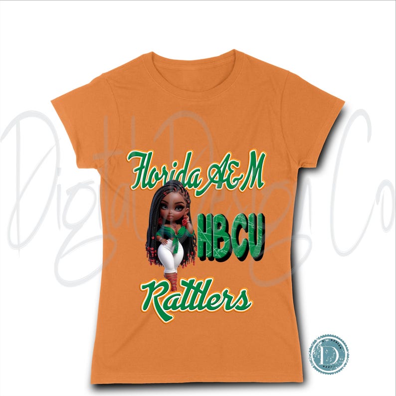 May include: Orange t-shirt with the text "Florida A&M HBCU Rattlers" in green script. A cartoon image of a doll with dark hair and a green top is centered on the shirt. The shirt is a crew neck style.