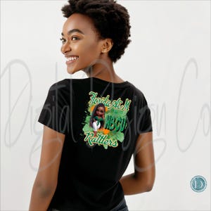 May include: Black t-shirt with a graphic on the back featuring a cartoon girl in a green and white outfit, with the text "Florida A&M HBCU Rattlers" in green and orange.