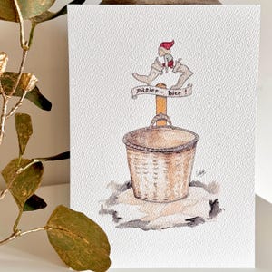May include: A watercolor illustration of a wicker basket with a sign that reads "Papier hier!"  Two small figures are standing on top of the sign. The figures are wearing red hats and are holding a piece of paper.