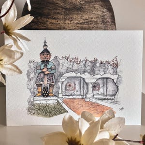 May include: Watercolor illustration of a guardian figure with a tall headdress, holding a staff, standing before a stone structure. The artwork features muted colors and intricate details, with a signature in the lower right corner.
