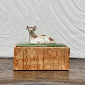 Vintage ceramic butter dish in the shape of a meadow with a cow lying on it - kitsch kitchen decor - retro butter box - 80s