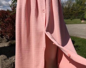 Falda midi de punto elástica estilo busnel vintage de los años 90, falda rosa claro con botones y bolsillos de parche, falda de punto de algodón, falda acampanada de corte A, falda rosa mediana